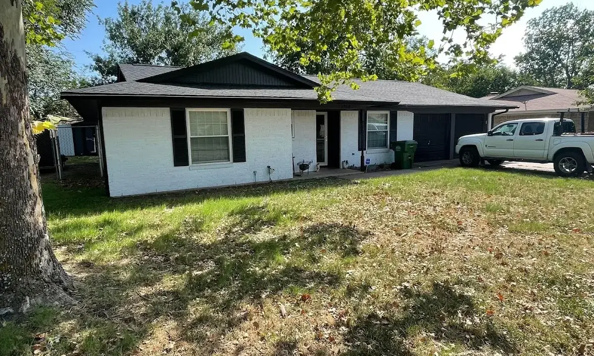 Professional roofing crew working on a residential roof in Lake City